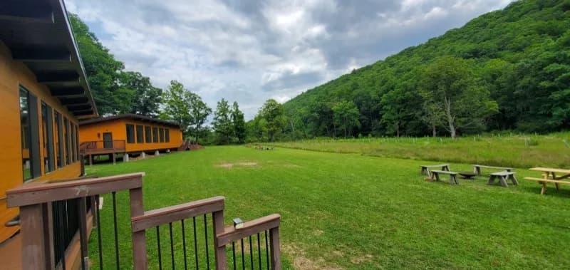 Wide view of the glamping pod cabins at River Mountain