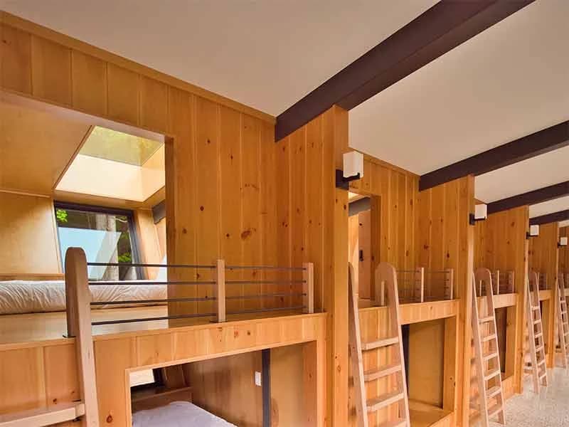 Loft-style sleeping nook inside a glamping pod