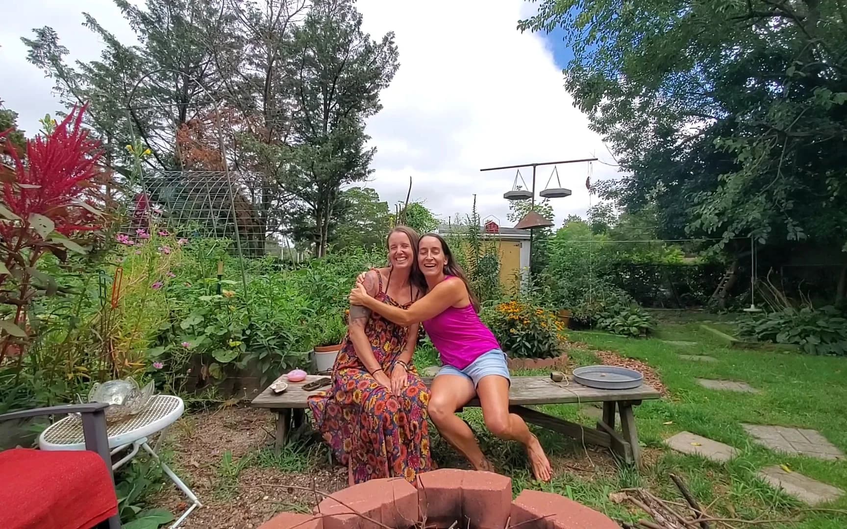 Jenn and Jill laughing together in the garden